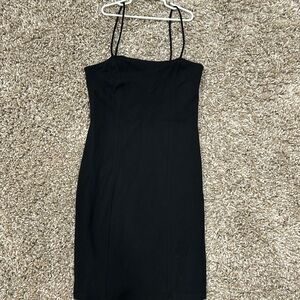 Cute, flattering fitted black cotton dress w/spaghetti straps. Cotton/ spandex